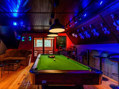 a billiard room with a pool table in it at Dunajec Mansion in Czchów