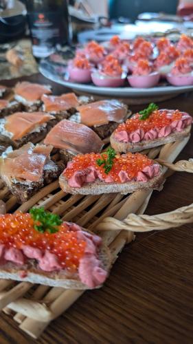 a bunch of food in a basket on a table at La demeure de vos désirs in Pressac