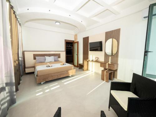 a bedroom with a bed and a mirror at Apartmens Aida Luks in Ulcinj