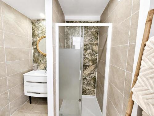 a bathroom with a shower and a sink at Cocon d'Amour & Spa in Le Thoronet
