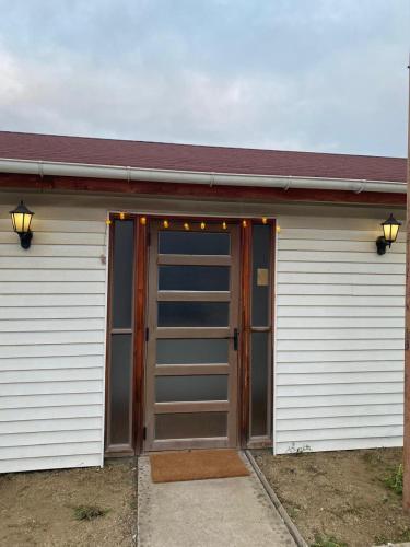 a garage with a door with lights on it at Hostal El Boldal Marchigüe in Marchihue