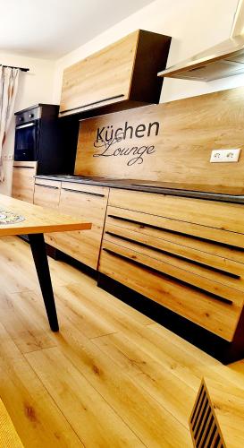 a room with a bed and a table in it at Apartment Katzensilber in Rothenthurm