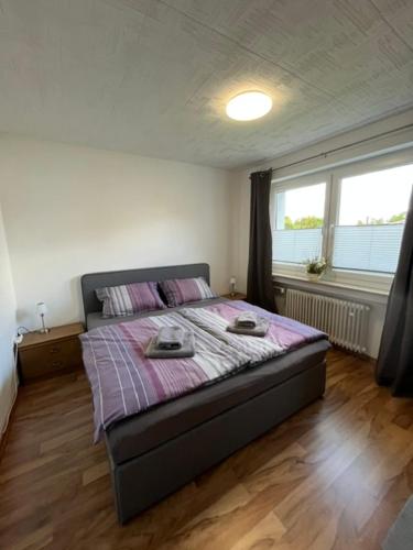 a bedroom with a bed with two plates on it at Apartment Bielefeld-Brake - nähe Bahnhof -Parken im Hof in Bielefeld