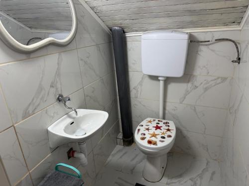 a bathroom with a toilet and a sink at Vikendica Jazina in Lastva