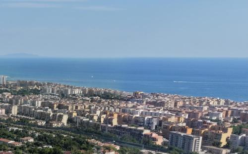 an aerial view of a city and the ocean at RESIDENCE SOLARIDE apartments, FREE PRIVATE PARKING WITH VIDEOSURVELLIANCE and SHUTTLE SERVICE in Salerno