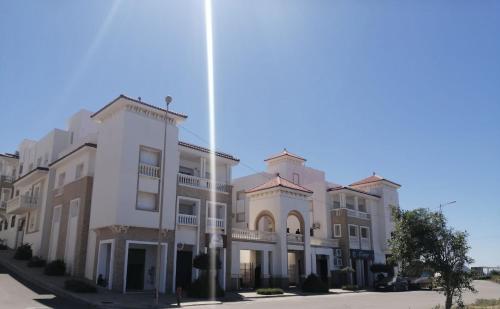 a row of apartment buildings on a street at Al Hoceima Hay Bades Villa in Al Hoceïma