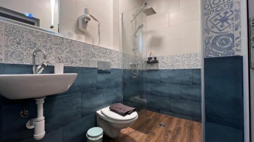 a bathroom with a sink and a toilet at Alice house in Sofia