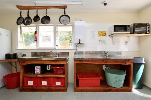 a kitchen with a counter and a sink at Rucksacker Backpacker Hostel in Christchurch