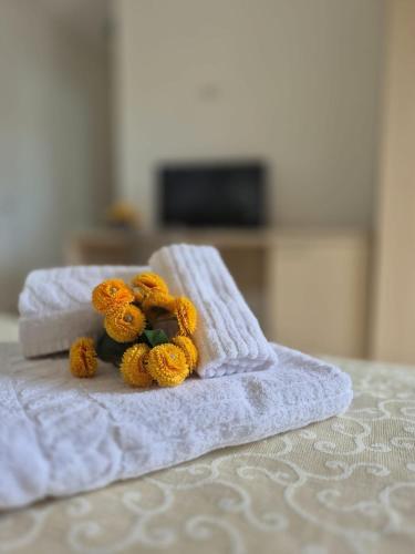 a group of teddy bears sitting on top of a bed at Albergo Athena Mare in Sibari
