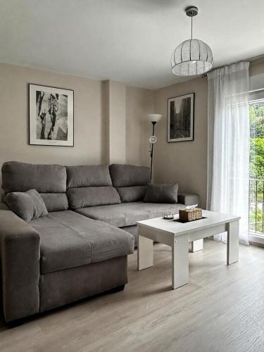 a living room with a couch and a table at Casa Aliseda in Béjar