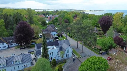 an aerial view of a town with houses and the water at Apartotel Berry Hohwacht in Hohwacht
