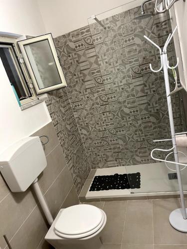 a bathroom with a shower and a toilet at Casa Sciavè - Paradise in Sciacca in Sciacca