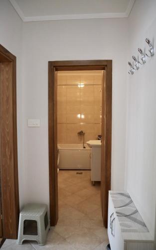 a bathroom with a tub and a toilet and a sink at PivApart Plužine in Plužine