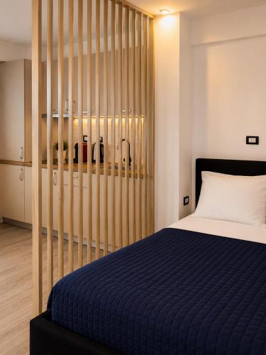 a bedroom with a bed and a wooden wall at Asi Marine Rentals in Saturn