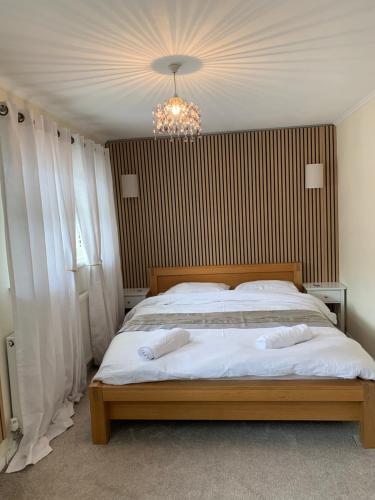 a bedroom with a bed with two pillows on it at Mountain View in Merthyr Vale