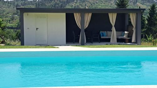 a view of a house from the water at Solar da Motta Douro Boutique Home in Ancede