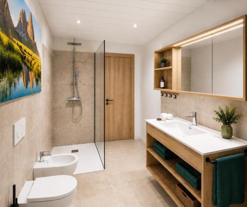 a bathroom with a sink and a toilet and a shower at Villa Erika - NEW Luxury Alpine Apartments from December 2026 in Sesto