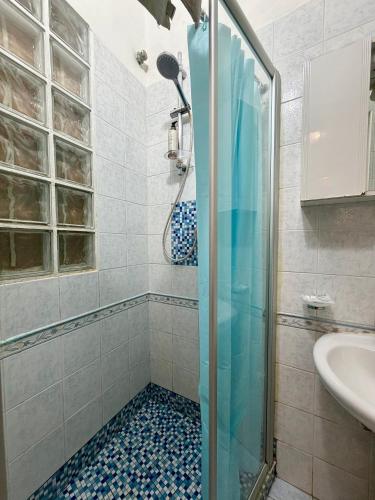 a bathroom with a shower and a sink at Casa Bella - Ortigia & Neapolis in Syracuse