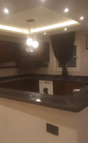 a kitchen with a bath tub in a room at جسر السويس نفرتاري in Obour