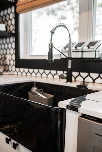 a kitchen counter with a sink and a sink at Made with Love in Thackerville