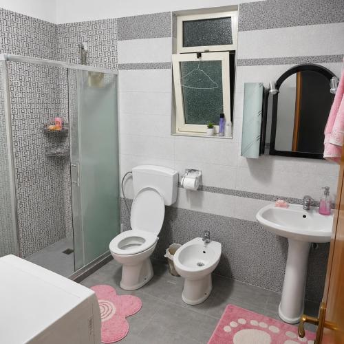 a toy bathroom with a toilet and a sink at Backpackers Durres in Durrës