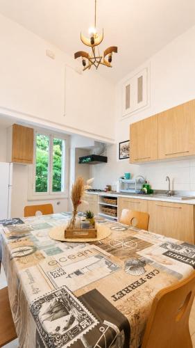 a kitchen with a table with a tablecloth on it at Casa Garzoglio in Noli