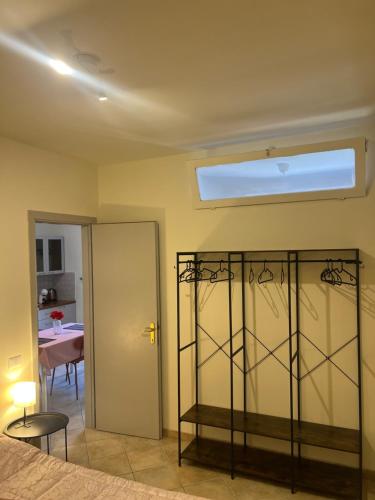 a bedroom with a bed and a window and a table at Casa Bellini in Gallinaro