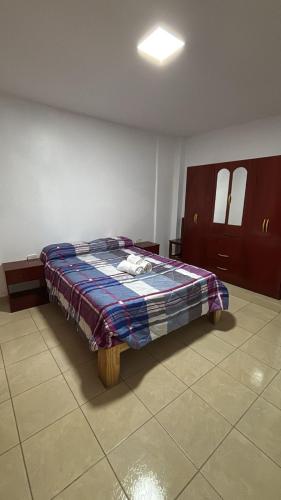a bedroom with a bed in a room at Apartamentos Villa Jardin in Reyes