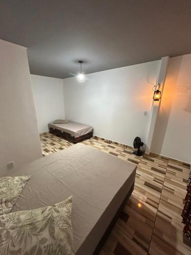 a bedroom with a large bed at Catavento in Paty do Alferes