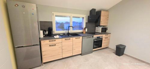 Le Barcarès - gîte "Carlit" climatisé 2 chambres pour 6 personnes, à 10 mns à pied de la plage et du village de Noël, avec place de parking