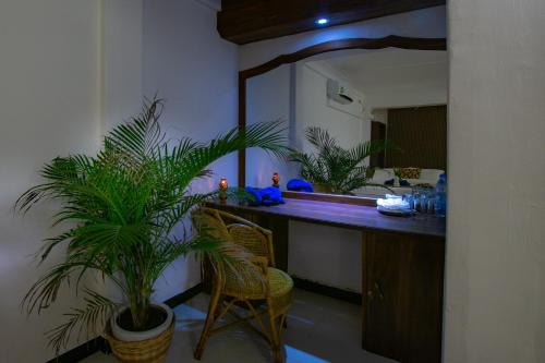 a bathroom with a sink and a mirror at Surf Resort Arugambay in Arugam Bay