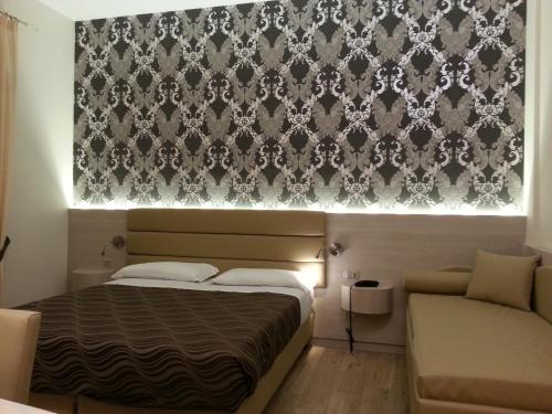 Una cama o camas en una habitación de Hotel Tre Torri