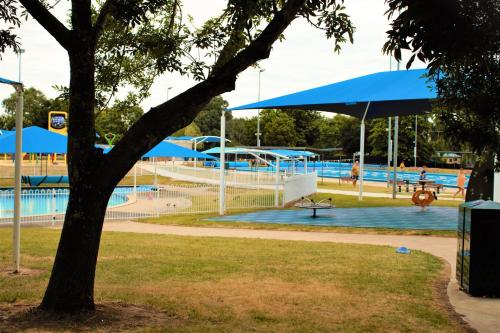 a water park with a pool and slides at Ballarat Eureka Lodge Motel in Ballarat