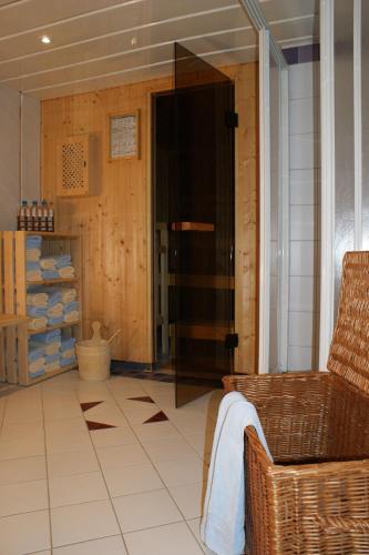 a room with a door and a tiled floor at Garni Soldanella in Samnaun