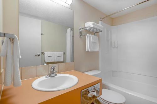 a bathroom with a sink and a toilet at Econo Lodge Inn & Suites in Kelowna
