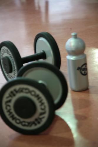 a pair of dumbbells next to a water bottle at Grand Hotel Rogaška Premium in Rogaška Slatina