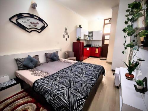 a bedroom with a bed in a room at Calm Corner in Panchkula