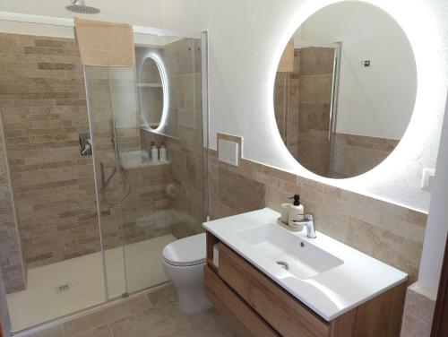 a bathroom with a sink and a mirror at Villa Abete Azzurro con Piscina in Casalvieri