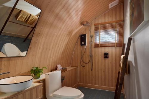 a bathroom with a sink and a toilet and a shower at Tube Resort by EHM in Koh Rong Sanloem