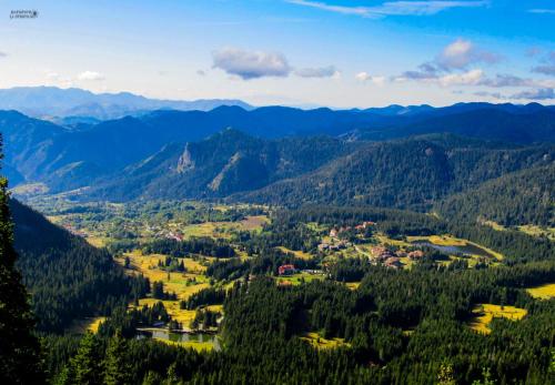 an aerial view of a village in the mountains at Finlandia Hotel in Pamporovo