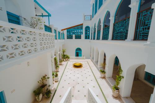 a courtyard with a fountain in the middle of a building at Al Bait Al Sharqi in Muscat