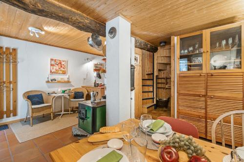 a kitchen and dining room with a table and chairs at Rustico Stock with free wifi- Happy Rentals in Lugano