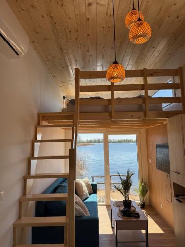 a room with bunk beds in a tiny house at Ośrodek Dalpol in Prażmowo