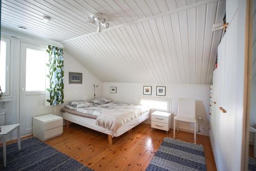 a bedroom with a bed and a white ceiling at Villa Golden Haven in Rovaniemi