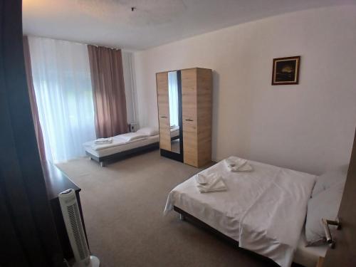 a hotel room with a bed and a mirror at OAZA Miokus in Miokus