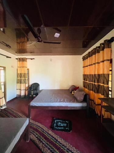 a bedroom with a bed in a room with curtains at Moon Light Villa in Panama