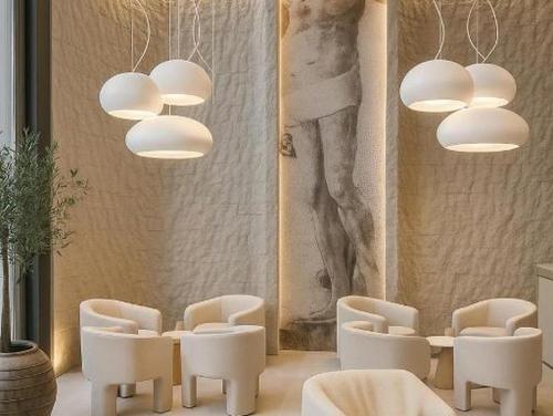 a room with white chairs and a table and chandeliers at Sunday Residence Split in Split