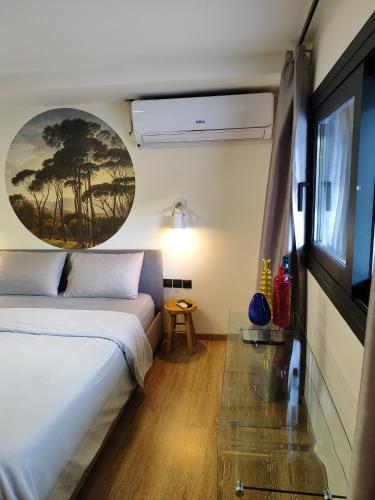 a hotel room with a bed and a window at Nest suite by Oikies Rentals in Neoi Epivates