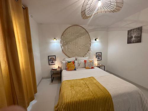 a bedroom with a bed with a large mirror on the wall at Ar Doce in Portel