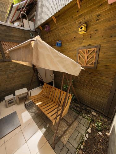 an umbrella sitting next to a bench on a patio at Marmara Guesthouse in Istanbul
